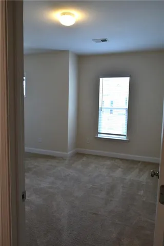 an empty room with closet area