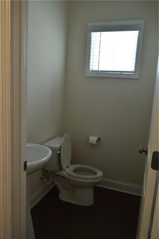 wooden floor in an empty room with a fireplace
