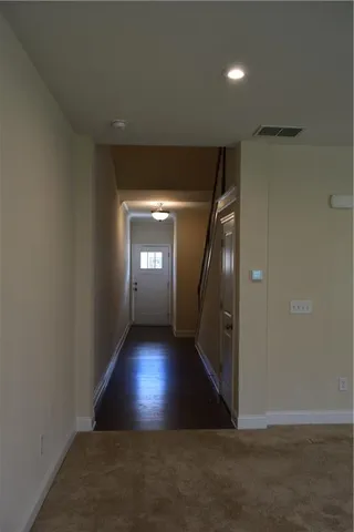 a view of empty room with a fireplace