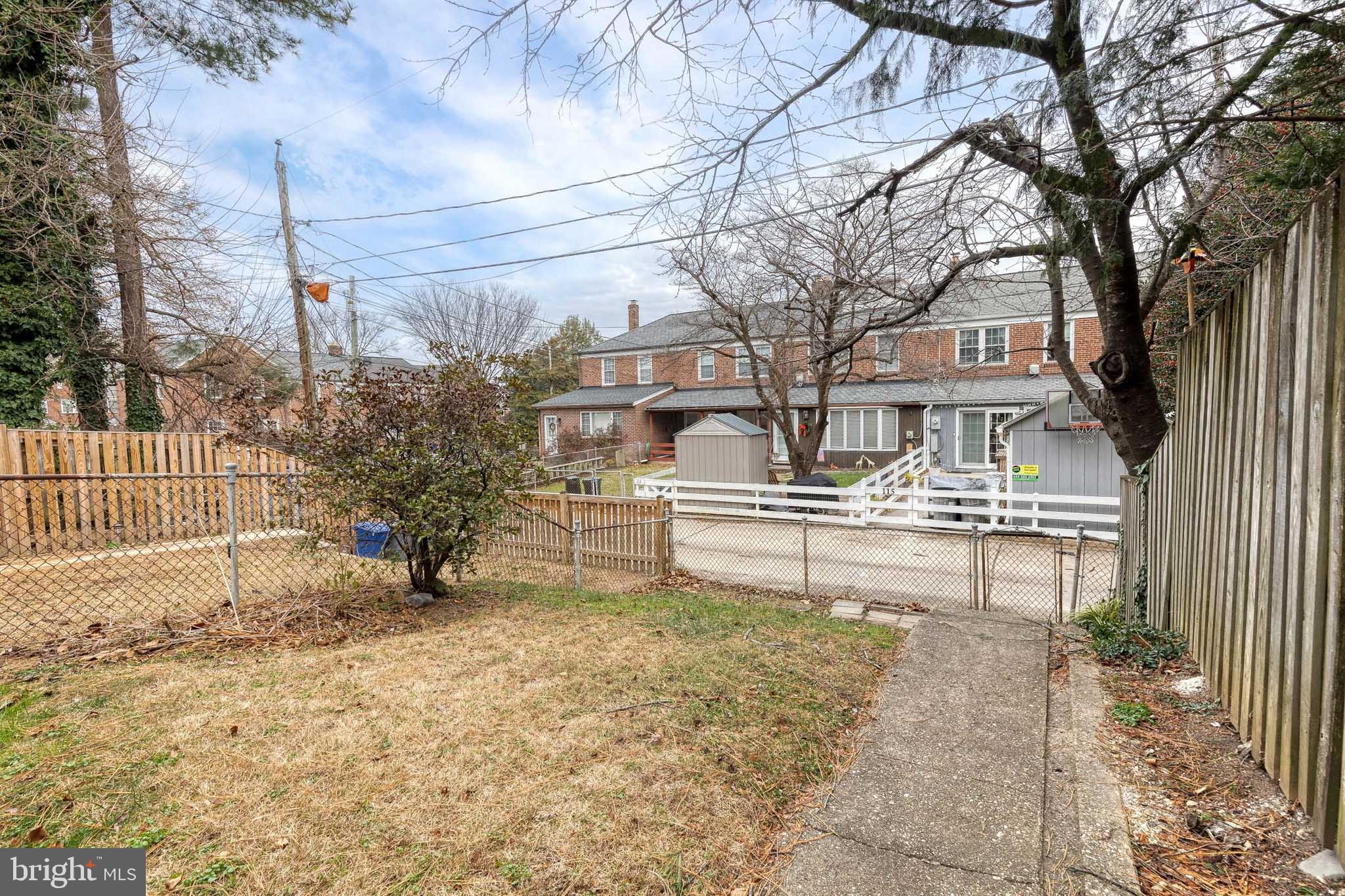 122 Regester Avenue Baltimore, MD 21212 - Photo 34 of 36 a house with trees in front of it
