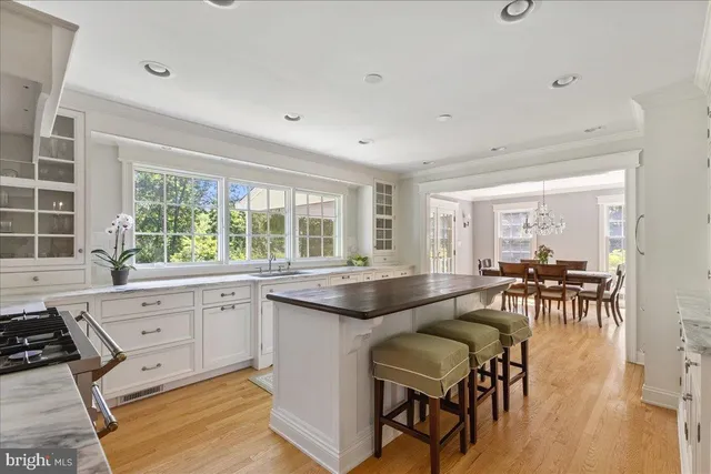 a living room with furniture and large windows