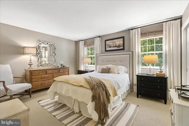 a bathroom with a sink toilet and mirror
