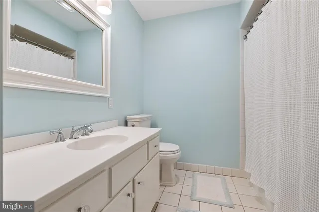 a view of an empty room with white walls