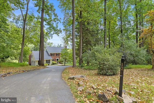 a view of a house with a tree in the background