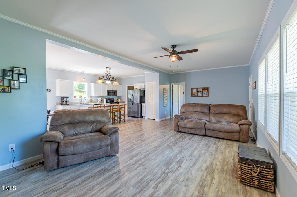 5912 Mt Zion Road Snow Camp, NC 27349 - Photo 13 of 33 a living room with furniture and a wooden floor