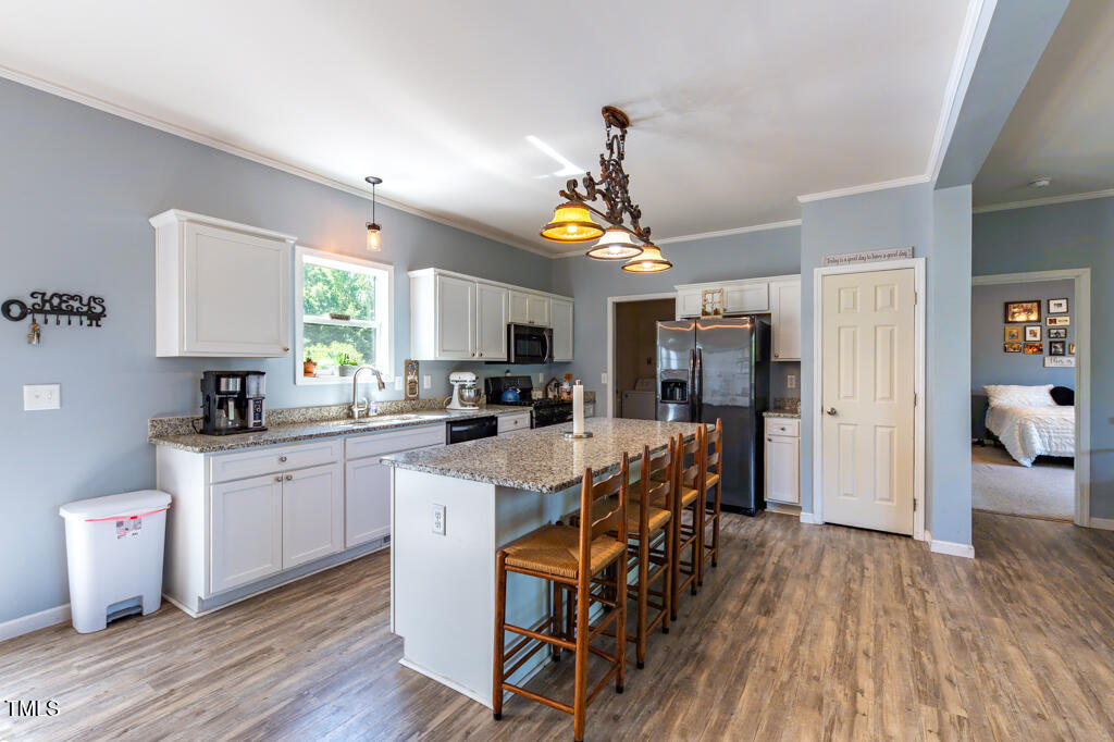 5912 Mt Zion Road Snow Camp, NC 27349 - Photo 15 of 33 a kitchen that has a lot of cabinets a sink and appliances in it