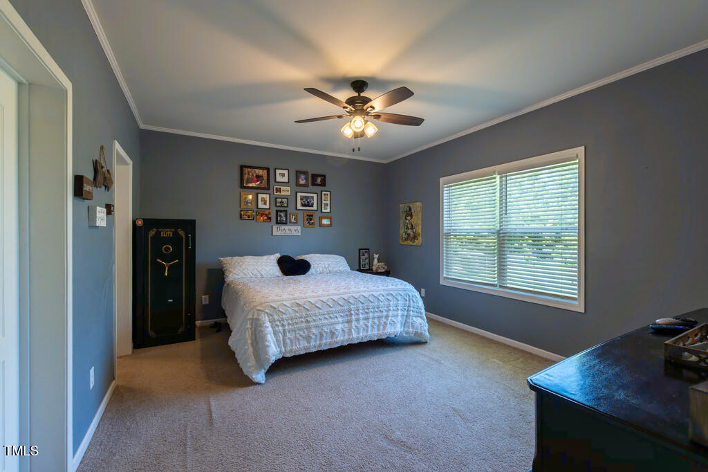 5912 Mt Zion Road Snow Camp, NC 27349 - Photo 19 of 33 a bedroom with a bed and a window