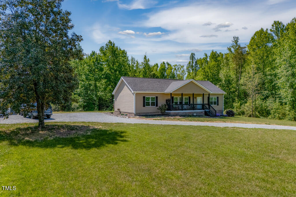 5912 Mt Zion Road Snow Camp, NC 27349 - Photo 2 of 33 a front view of a house with garden