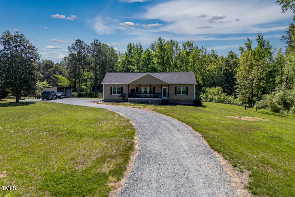 5912 Mt Zion Road Snow Camp, NC 27349 - Photo 5 of 33 a view of a house with a big yard