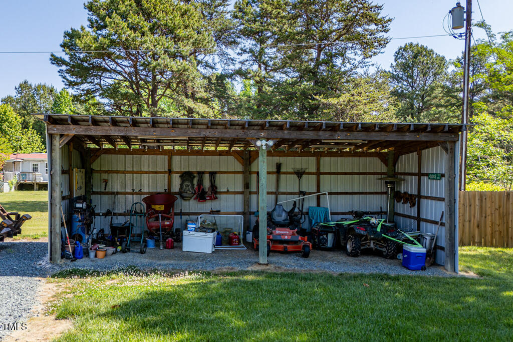 5912 Mt Zion Road Snow Camp, NC 27349 - Photo 6 of 33 a view of a yard with table and chairs