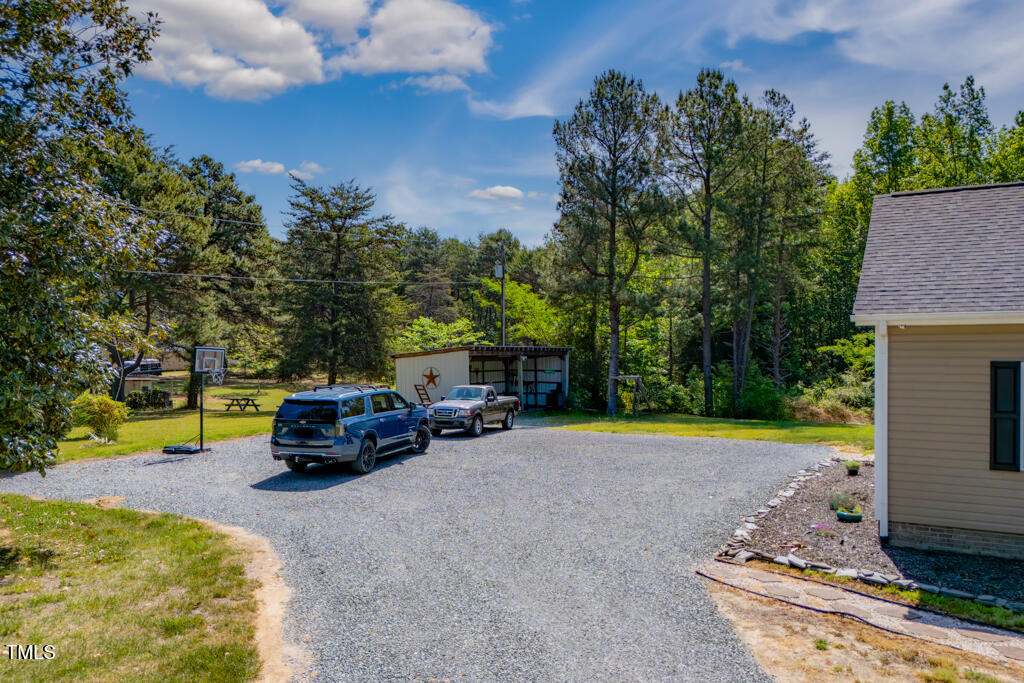 5912 Mt Zion Road Snow Camp, NC 27349 - Photo 7 of 33 a view of a house with swimming pool and sitting area
