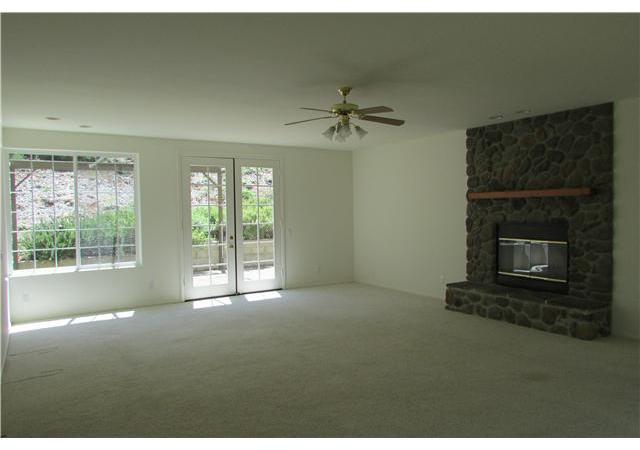 775 East Incense Cedar Road Julian, CA 92036 - Photo 11 of 25 Rock faced fireplace. Carpet.