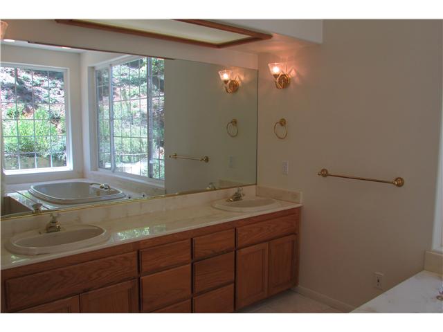 775 East Incense Cedar Road Julian, CA 92036 - Photo 14 of 25 Double sinks.Tile floor. Built in drawers. Large walk in closet. Space for mini fridge and tv stand. Double head shower. Toilet and bidet.