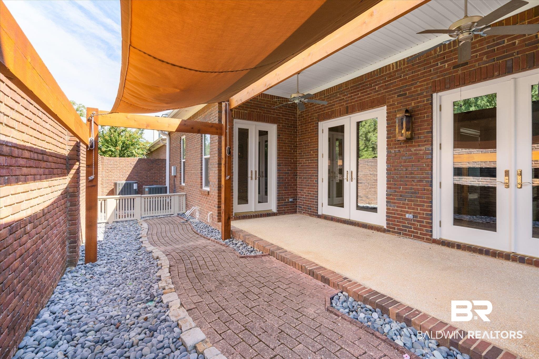 107 Fielding Place Mobile, AL 36608 - Photo 23 of 27 View of patio / terrace with french doors, a ceiling fan, and fence