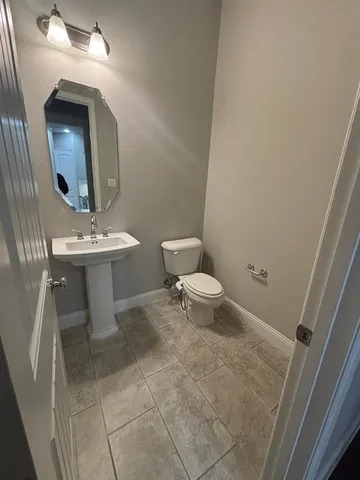 a stove top oven sitting inside of a kitchen