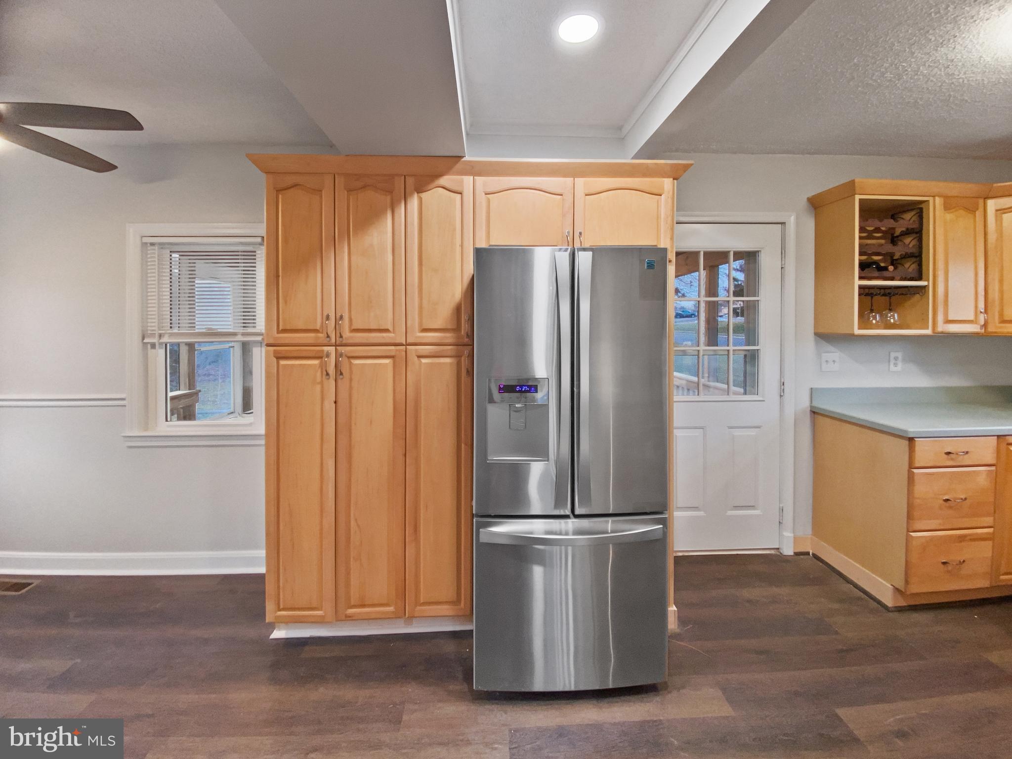 2897 Willoughby Road Baltimore, MD 21234 - Photo 10 of 33 Large pantry cabinets and new refrigerator.