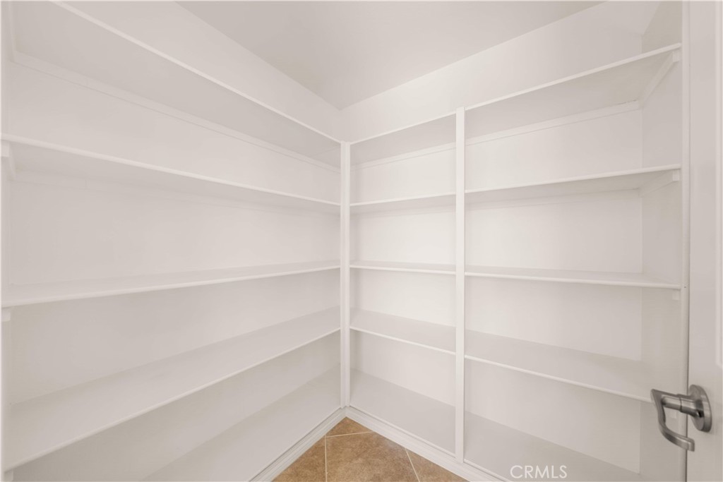 13296 Joliet Drive Rancho Cucamonga, CA 91739 - Photo 14 of 69 a view of an empty walk in closet
