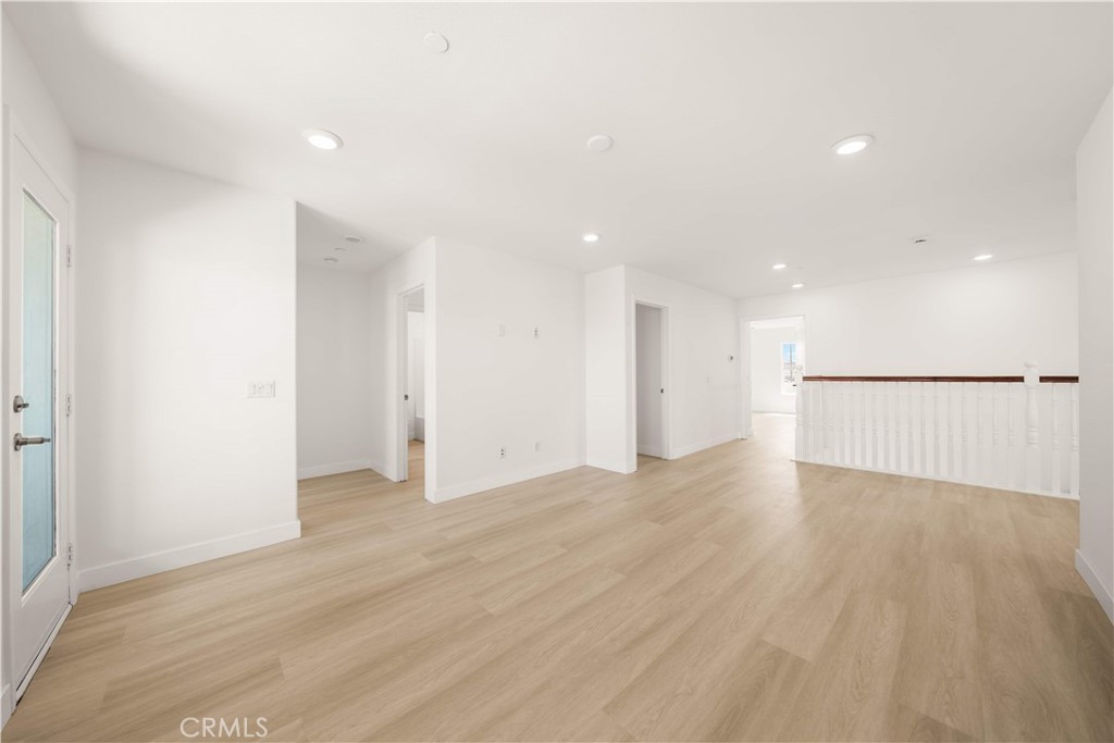 13296 Joliet Drive Rancho Cucamonga, CA 91739 - Photo 19 of 69 a view of an empty room with wooden floor