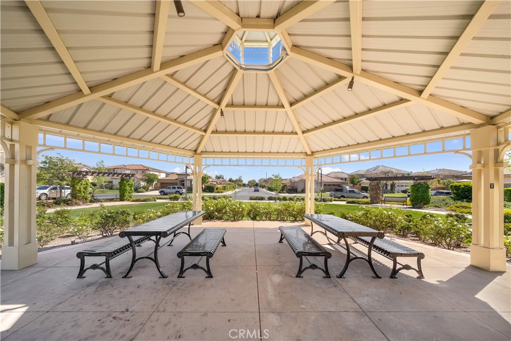 13296 Joliet Drive Rancho Cucamonga, CA 91739 - Photo 58 of 69 a view of a patio with a table and chairs under an umbrella
