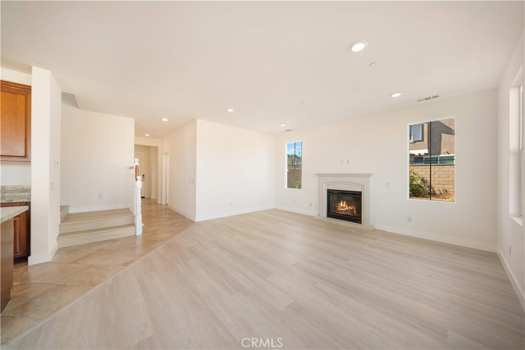 13296 Joliet Drive Rancho Cucamonga, CA 91739 - Photo 6 of 69 an empty room with windows and fireplace