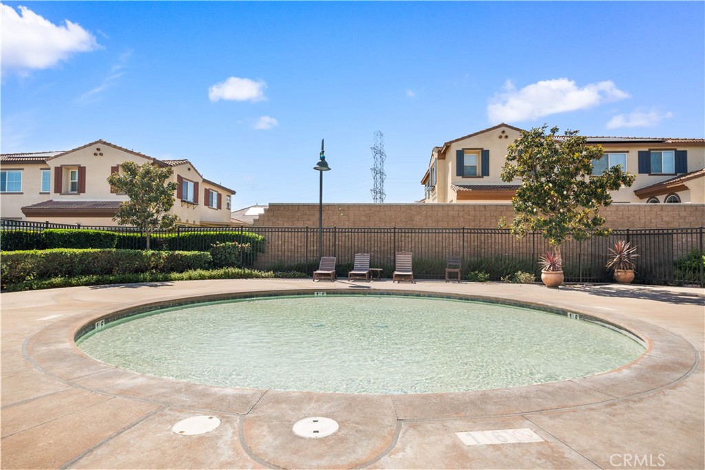 13296 Joliet Drive Rancho Cucamonga, CA 91739 - Photo 63 of 69 a view of a house with pool and a yard