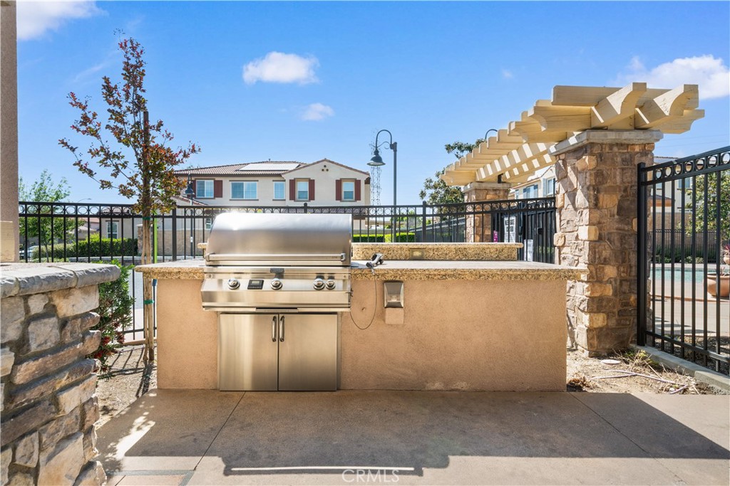 13296 Joliet Drive Rancho Cucamonga, CA 91739 - Photo 67 of 69 a front view of a house with a yard