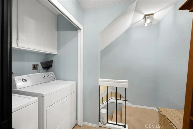 a en suite bathroom with a granite countertop sink and a mirror