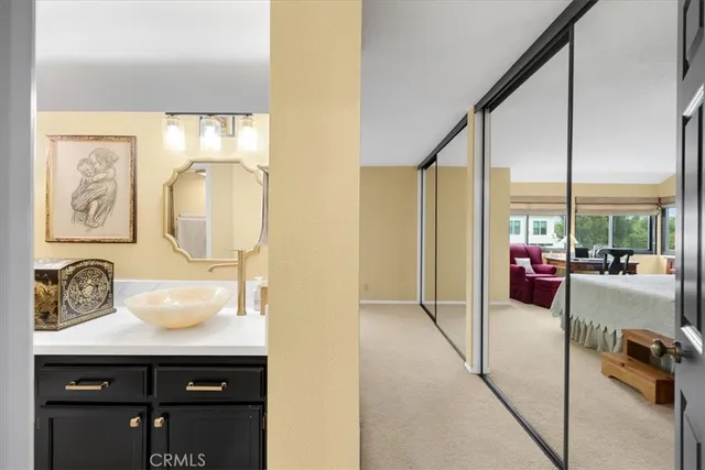 a bathroom with a double vanity sink mirror and shower