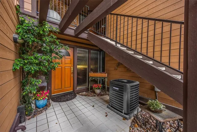 a view of stairs and potted plants