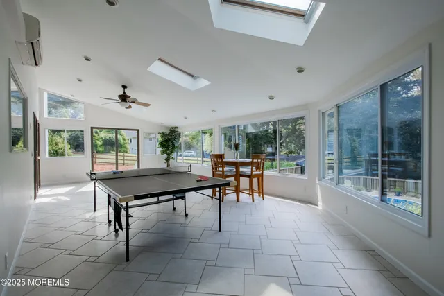 a room with furniture and a large window