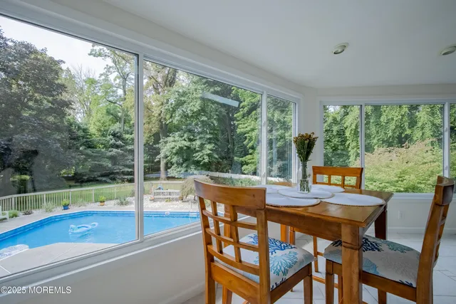 a view of a dining room with furniture window and outside view