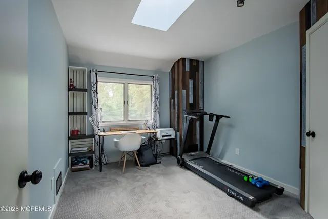 a room with gym equipment and a window