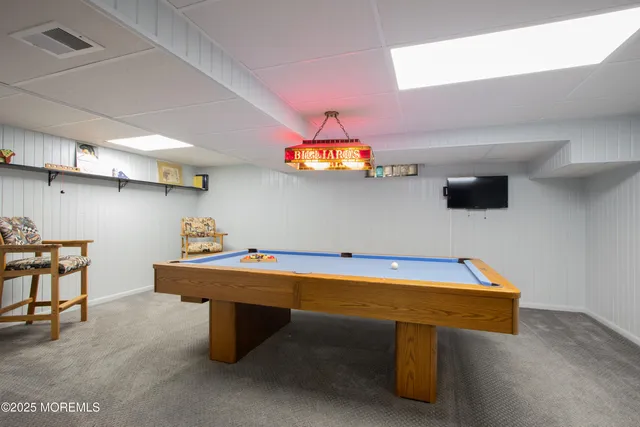 a room with furniture and wooden floor