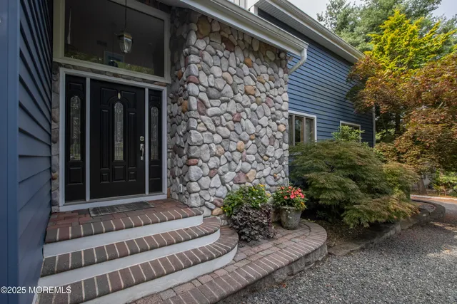 a view of house with wooden floor and a potted plant