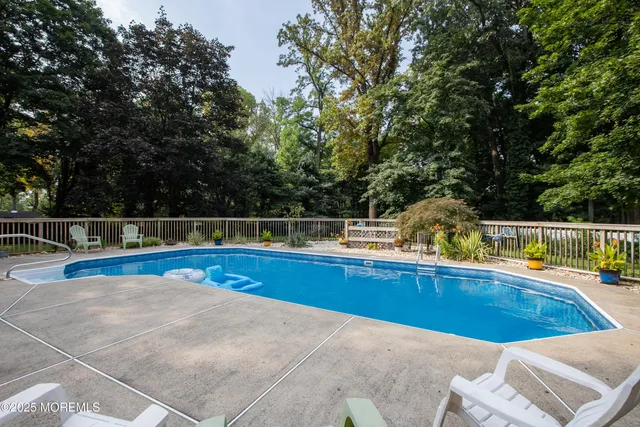 a view of a swimming pool with a lounge chair