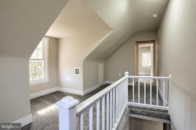 a view of an entryway with wooden floor