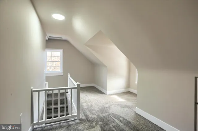 an entryway in a hall with a window