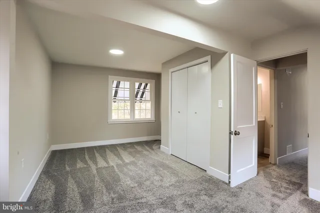 a view of an empty room and window