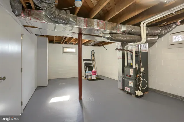 a view of empty room with wooden ceiling