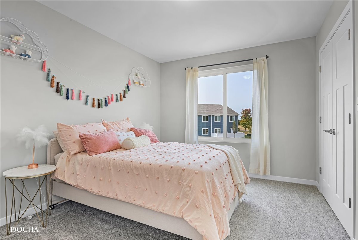 1232 Gillespie Lane Yorkville, IL 60560 - Photo 12 of 17 a bedroom with a bed and a window