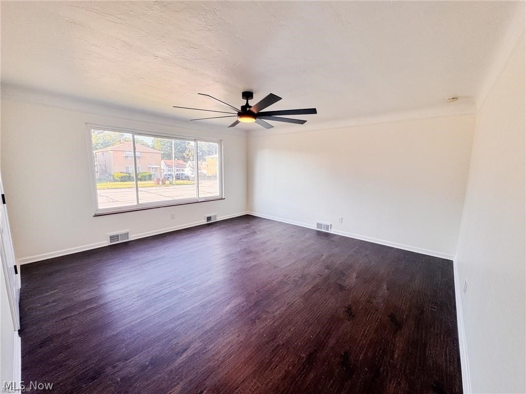 2907 Snow Road, Unit UP Cleveland, OH 44134 - Photo 7 of 19 Empty room with dark wood-style floors and ceiling fan
