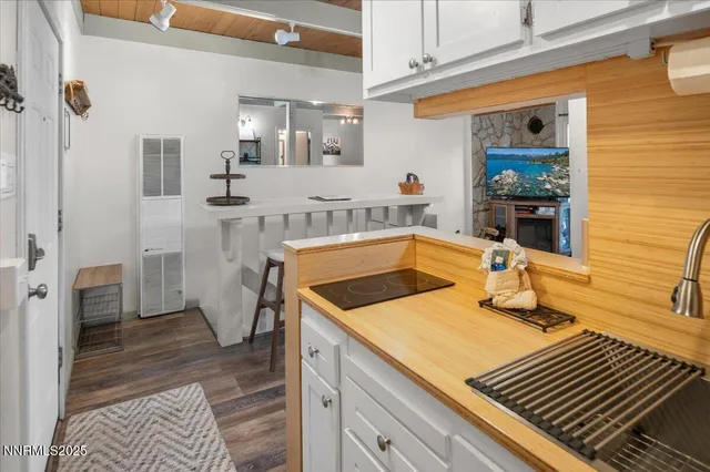 a kitchen with a sink and cabinets