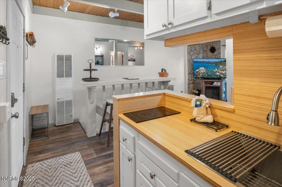 331 Tramway Drive, Unit 4 Stateline, NV 89449 - Photo 5 of 18 a kitchen with a sink and cabinets
