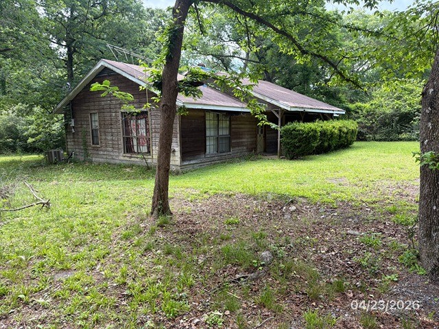10580 Greenridge Road Conroe, TX 77303 - Photo 2 of 10 a front view of a house with a yard
