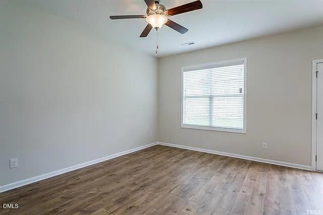 134 West Lumber Court Clayton, NC 27520 - Photo 12 of 23 wooden floor in an empty room with a window