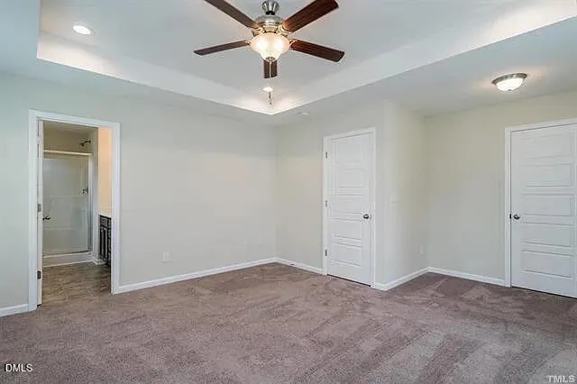 a view of room with window and ceiling fan