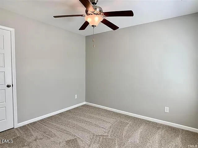 134 West Lumber Court Clayton, NC 27520 - Photo 16 of 23 an empty room with closet and a chandelier fan
