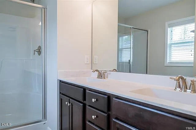 134 West Lumber Court Clayton, NC 27520 - Photo 20 of 23 a bathroom with a sink and a mirror