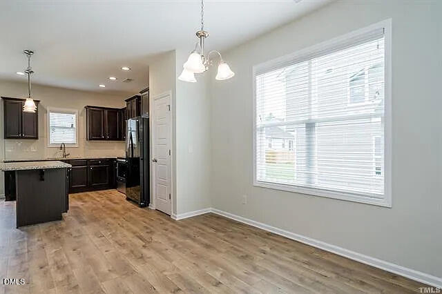 134 West Lumber Court Clayton, NC 27520 - Photo 5 of 23 a view of a kitchen with a sink and microwave