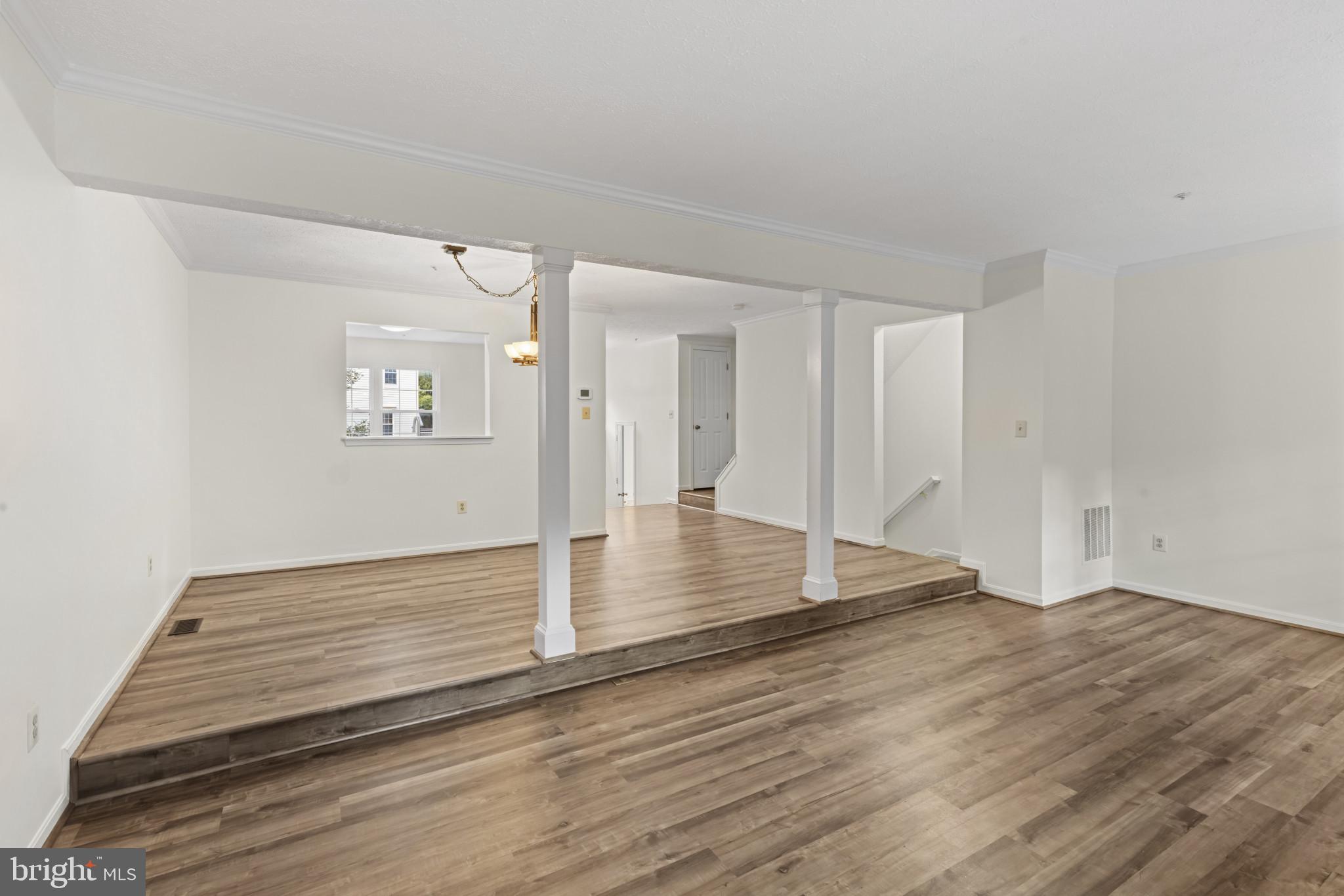 2584 Windy Oak Court Crofton, MD 21114 - Photo 13 of 40 Step Down Between Dining and Living Rooms